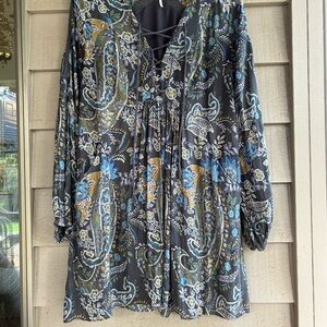 Free People mini dress or Tunic style 33” length. Paisley knit trim lace up neck